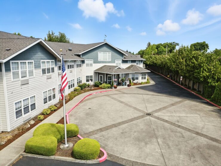 A welcoming retirement community surrounded by greenery, promoting comfort and connection.