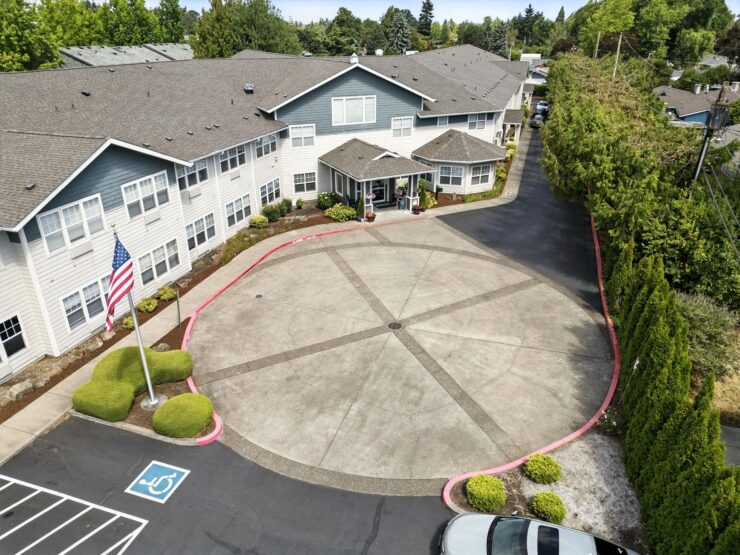 A welcoming entrance surrounded by greenery, creating a peaceful community atmosphere for residents.