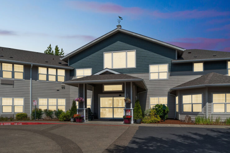 A welcoming retirement community, featuring a charming entrance and vibrant surroundings, fostering connection.
