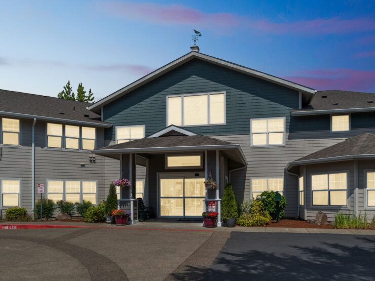 A welcoming retirement community, featuring a charming entrance and vibrant surroundings, fostering connection.