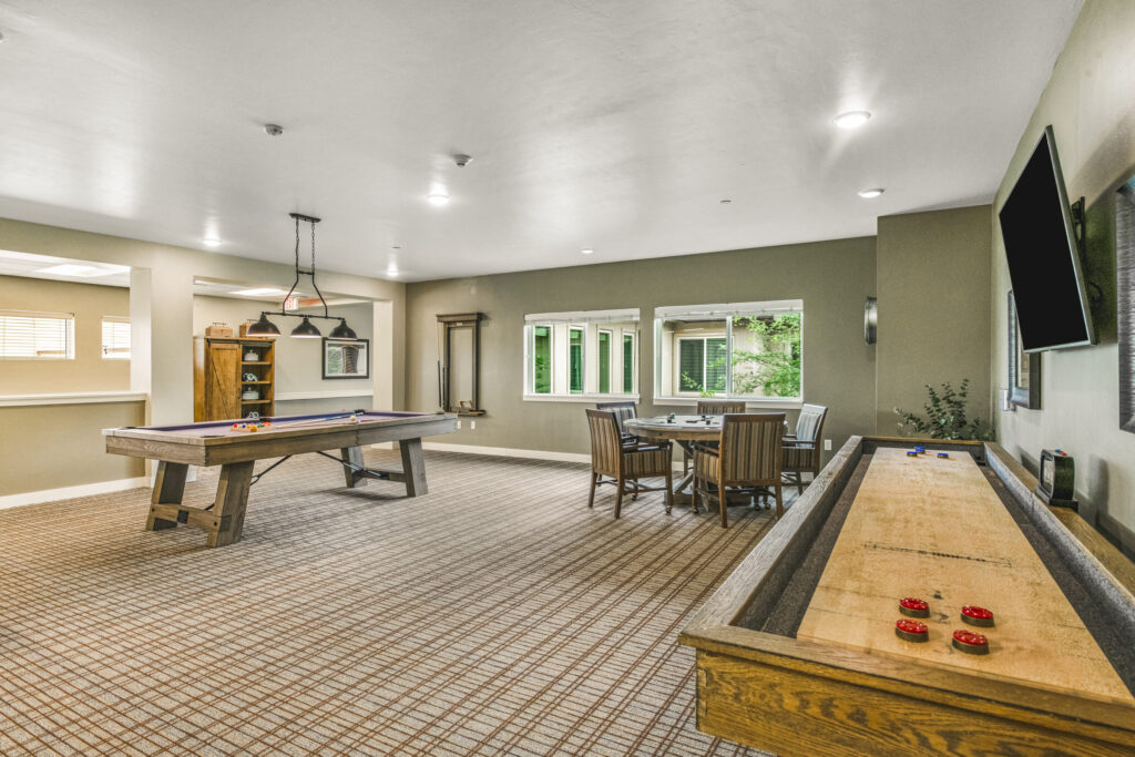 A welcoming recreation room filled with light, perfect for engaging activities and community gatherings.
