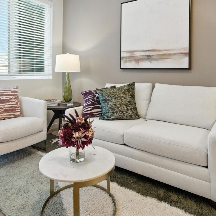 Bright, welcoming living space with comfortable seating, perfect for community gatherings and relaxation.