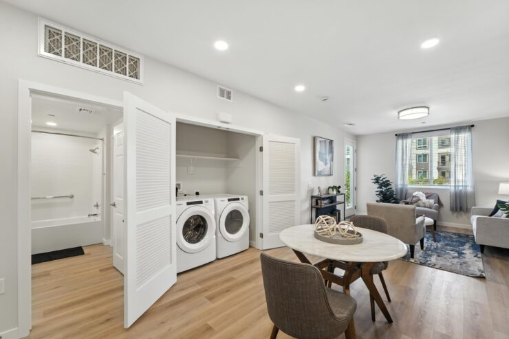 Bright and inviting space with a communal dining area, promoting comfort and connection among residents.