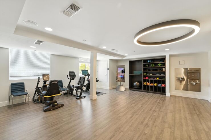 A bright, inviting fitness space featuring modern equipment and community resources for active living.