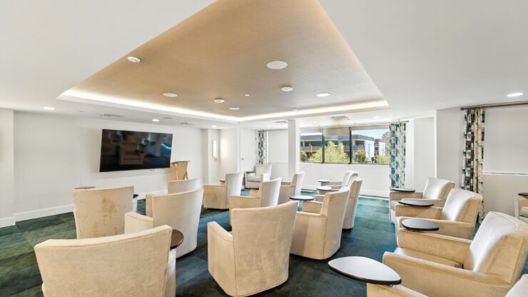 Bright and inviting space designed for community gatherings, featuring comfortable seating and ample natural light.