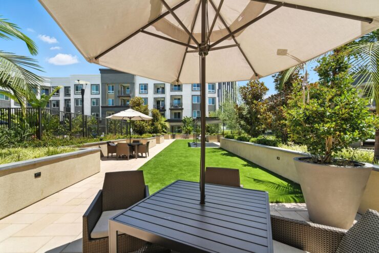 A welcoming outdoor space with shaded seating, perfect for gatherings and enjoying nature together.