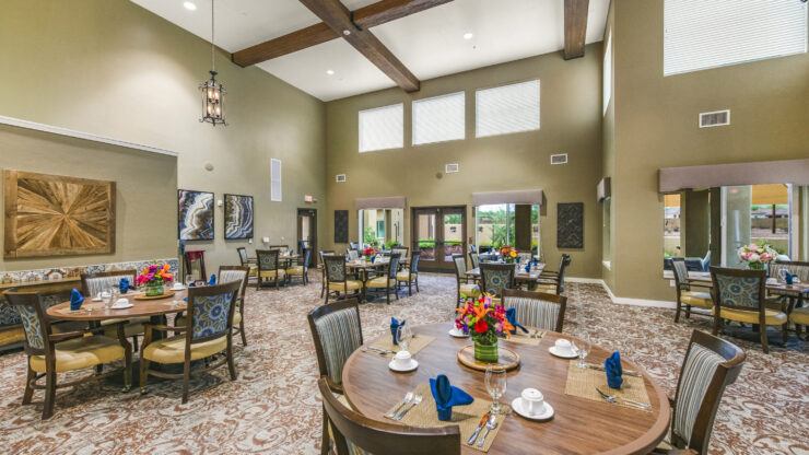 Bright, inviting dining area with elegant decor, fostering community and comfort for all residents.