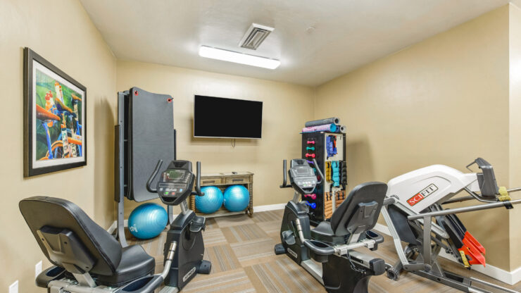 A welcoming fitness area designed for active living, featuring modern equipment and a bright atmosphere.
