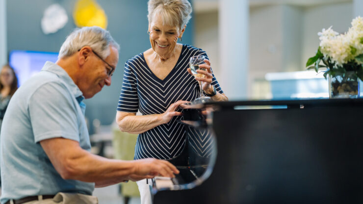 A lively gathering with residents enjoying music and each other's company, fostering joy and connection.