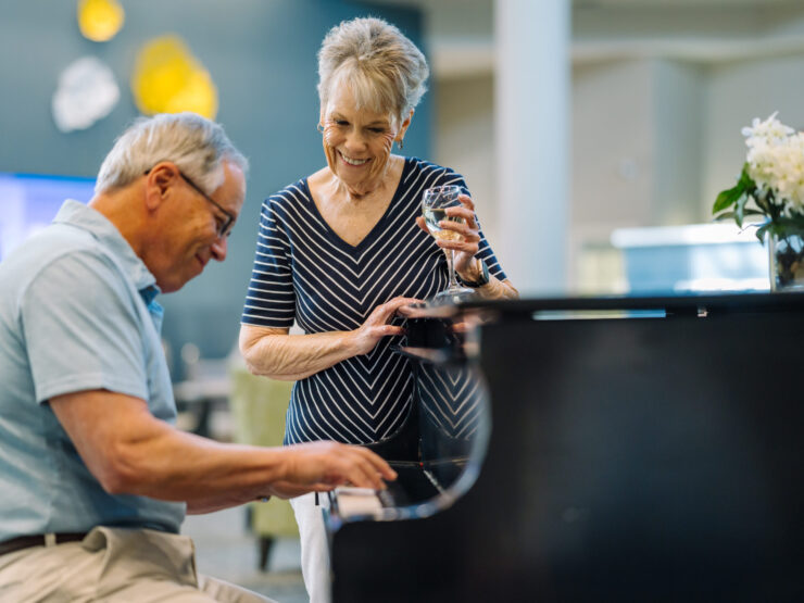A lively gathering with residents enjoying music and each other's company, fostering joy and connection.