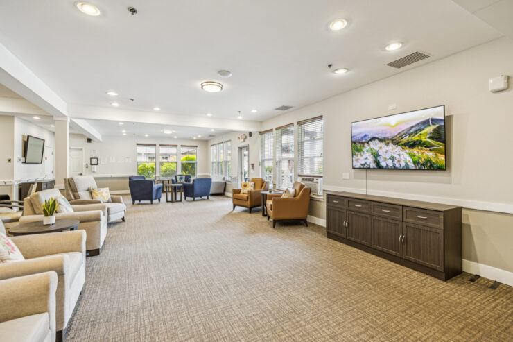 Inviting common area featuring comfortable seating, natural light, and a warm, welcoming atmosphere.