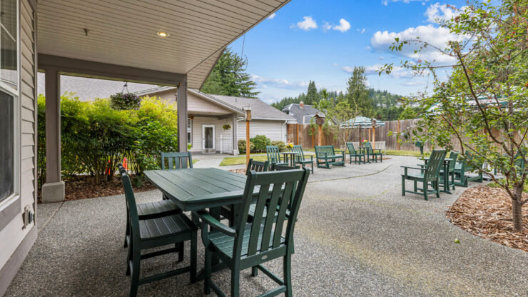 A serene outdoor space with inviting seating, perfect for community gatherings and relaxation.