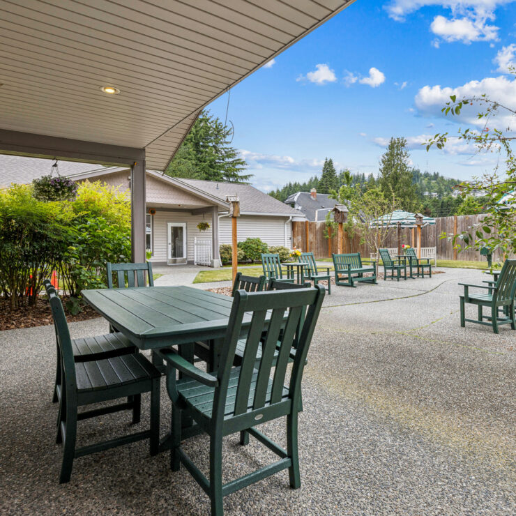 A serene outdoor space with inviting seating, perfect for community gatherings and relaxation.