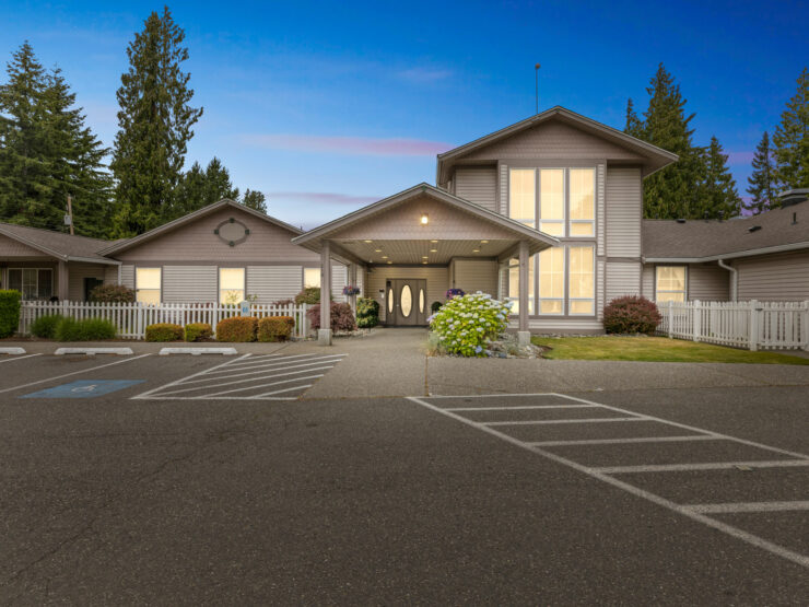 A welcoming entrance surrounded by greenery, inviting residents into a warm, community-focused environment.