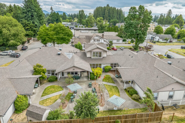 A welcoming community with lush greenery, inviting pathways, and comfortable seating for relaxation.