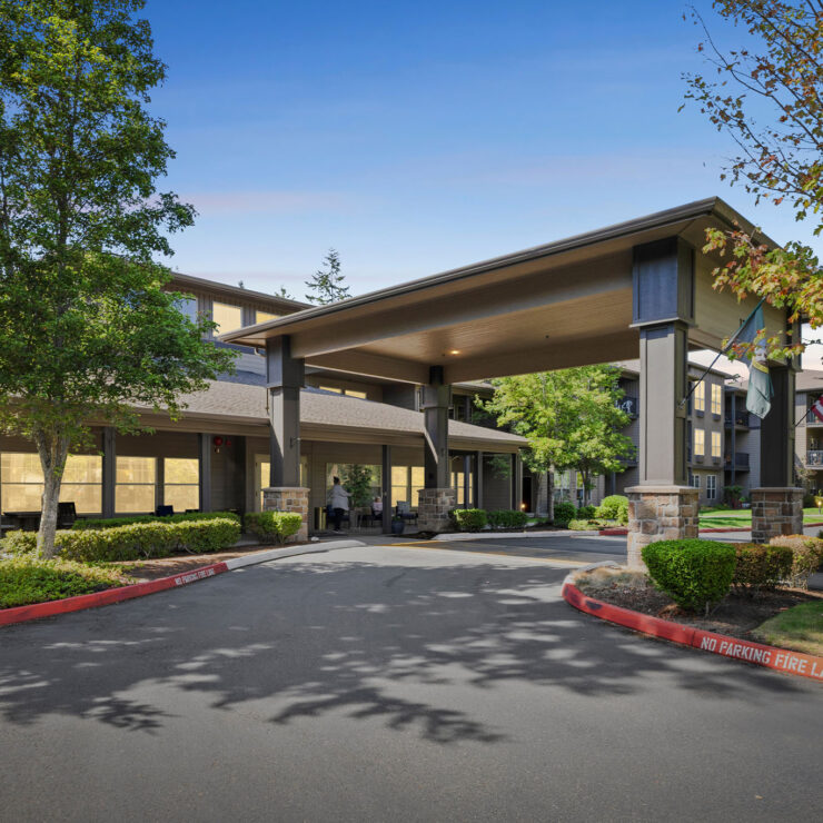 A welcoming entrance surrounded by greenery, inviting residents to enjoy a vibrant community atmosphere.