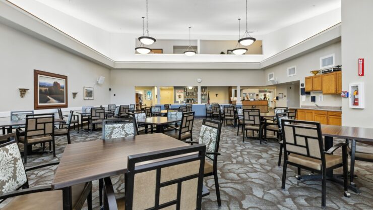 A welcoming dining area filled with light, inviting residents to gather and enjoy community meals together.