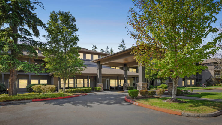 A welcoming entrance surrounded by lush greenery, inviting residents to enjoy a vibrant community.