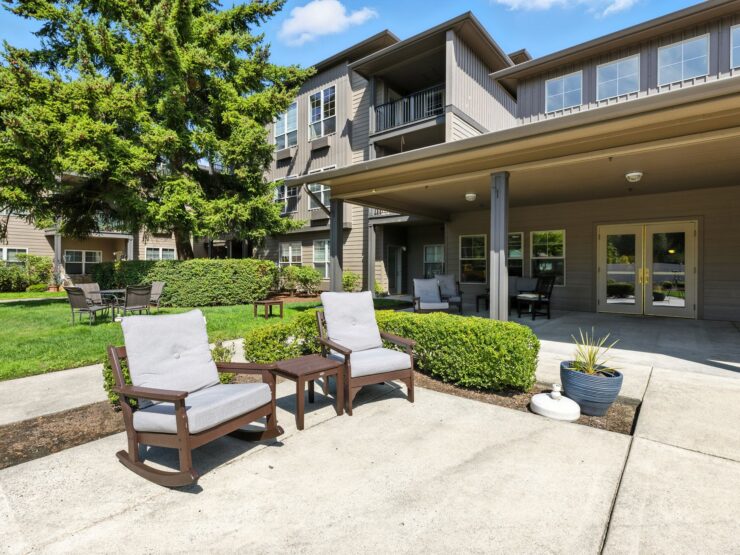 A welcoming outdoor space featuring comfortable seating, lush greenery, and a friendly atmosphere for all.