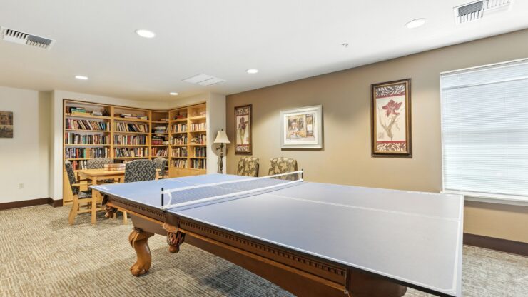 A welcoming game room featuring a pool table, inviting residents to enjoy friendly gatherings and fun.