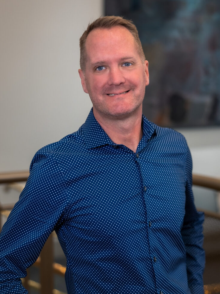 A welcoming environment showcasing a friendly staff member, embodying community and warmth.