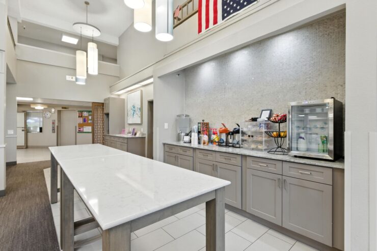 A welcoming communal kitchen space, fostering connection and comfort among residents.
