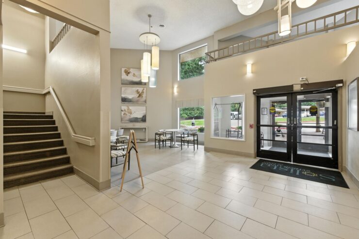 A welcoming lobby with inviting seating and natural light, fostering a sense of community and comfort.