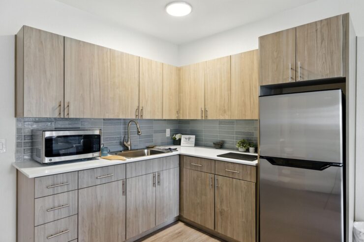 A bright, welcoming kitchen featuring modern appliances, inviting warmth, and a sense of community.