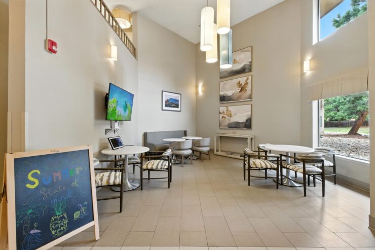 Bright, inviting common area with comfortable seating, perfect for community gatherings and relaxation.