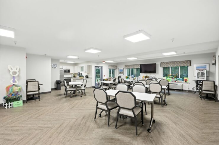 Bright and inviting communal space fosters connection, featuring comfortable seating and cheerful decor.