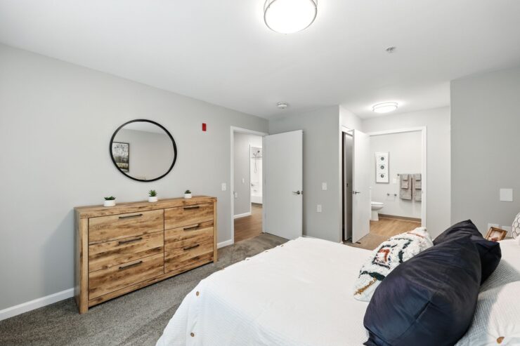 Bright and inviting bedroom with modern decor, promoting a sense of warmth and community.