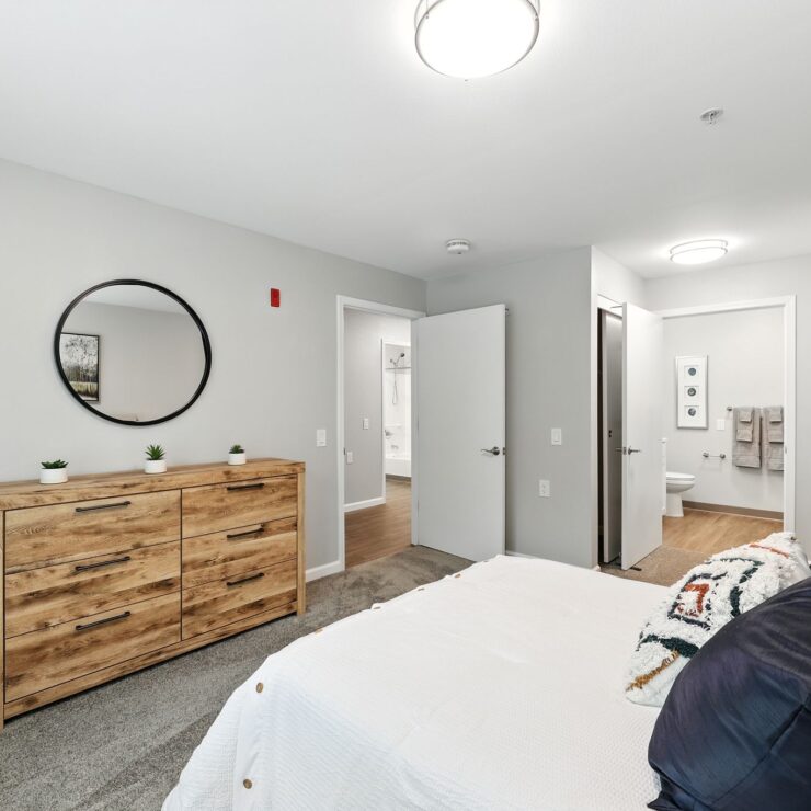 Bright and inviting bedroom with modern decor, promoting a sense of warmth and community.