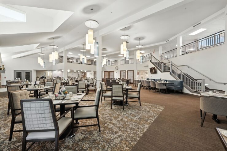 Bright, inviting dining area with comfortable seating, perfect for community gatherings and shared meals.