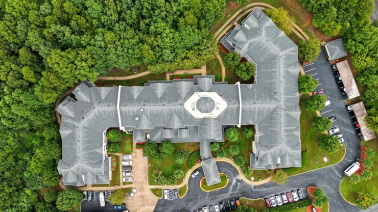 A welcoming community surrounded by lush greenery, offering comfort and connection for all residents.