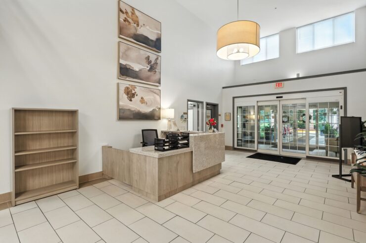Bright and welcoming lobby featuring warm decor, inviting seating, and a sense of community.