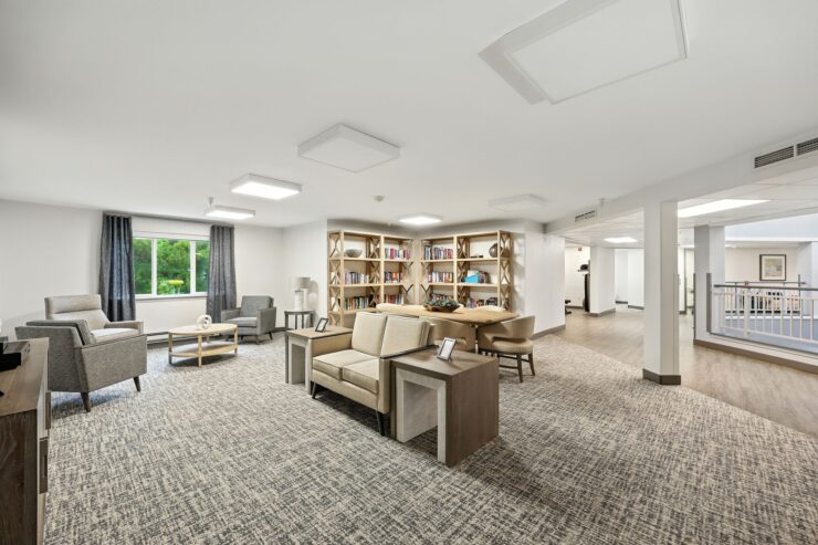Bright, inviting space with comfortable seating and a cozy library, fostering community and connection.