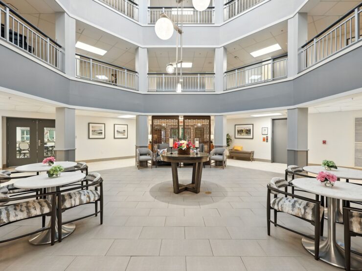 Bright and inviting common area, featuring elegant seating and floral accents, fostering community connections.