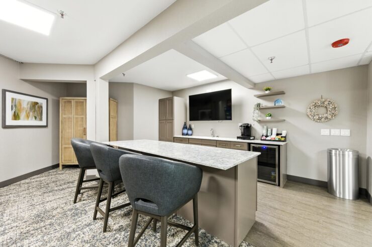 A welcoming communal space featuring a modern kitchen island, ideal for gatherings and connection.