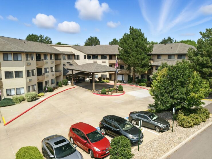 A welcoming entrance surrounded by lush greenery, inviting residents to a vibrant community.