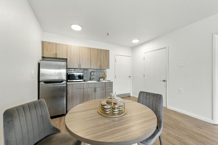 A bright, inviting kitchen and dining area, perfect for community gatherings and shared meals.