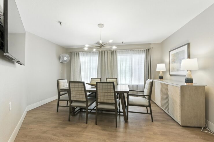 A welcoming dining area with natural light, inviting conversation and connection among residents.
