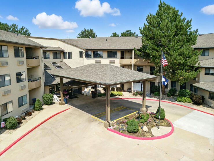 A welcoming entrance with lush landscaping, inviting residents to enjoy a vibrant community atmosphere.