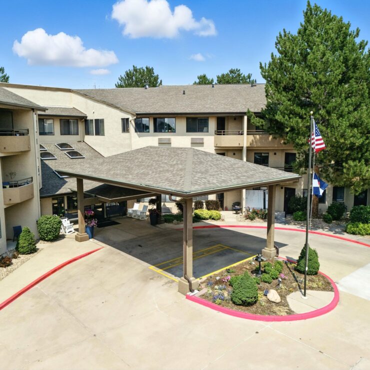A welcoming entrance with lush landscaping, inviting residents to enjoy a vibrant community atmosphere.