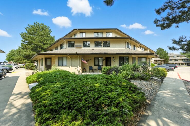 A welcoming residence surrounded by lush greenery, inviting community and comfort for all.