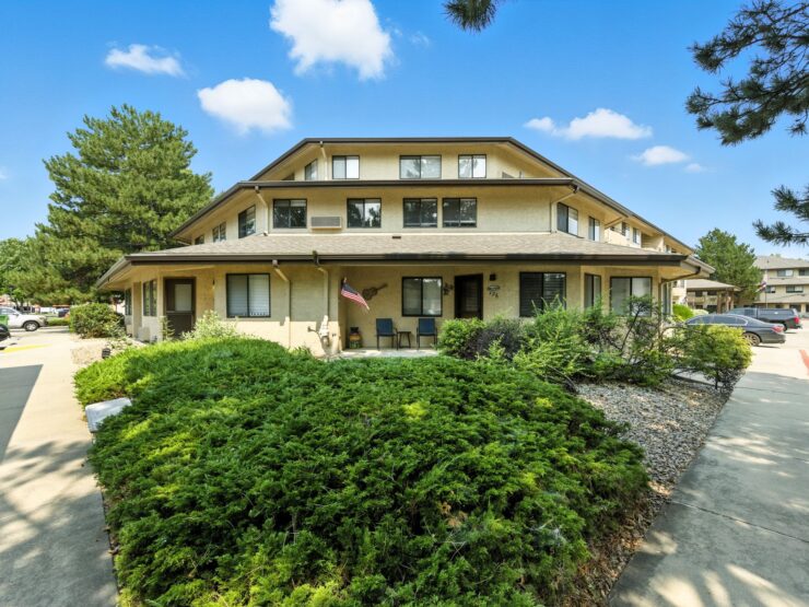 A welcoming residence surrounded by lush greenery, inviting community and comfort for all.