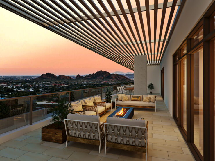 A serene terrace with inviting seating, perfect for community gatherings against a stunning sunset backdrop.