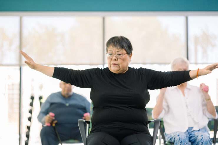 A vibrant exercise class fosters community and connection among residents, promoting well-being and joy.