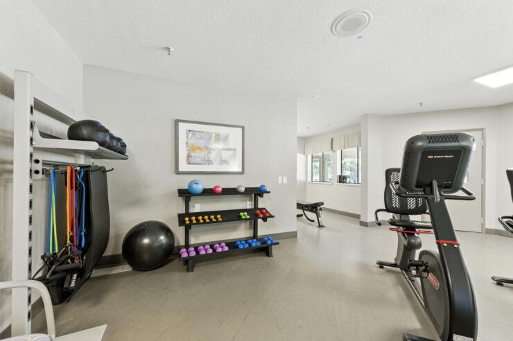 A bright fitness area filled with diverse equipment, inviting residents to stay active and engaged.