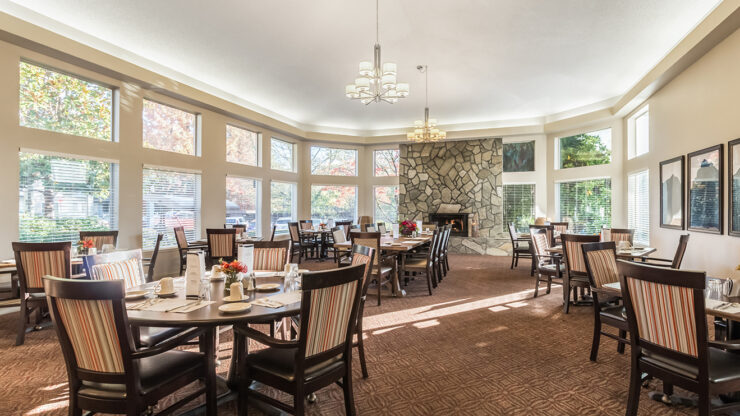 Bright and inviting dining area with ample natural light, fostering community and comfort.