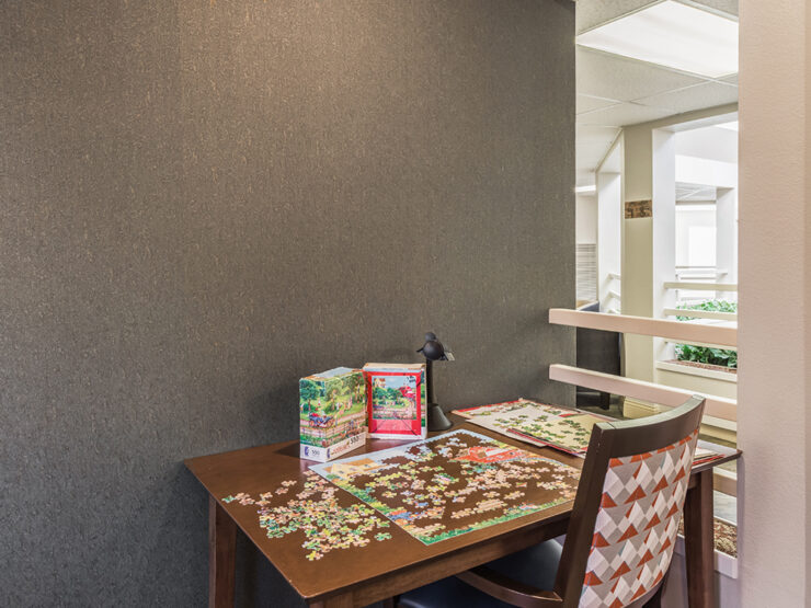 A welcoming space invites residents to connect over puzzles, fostering community and creativity.